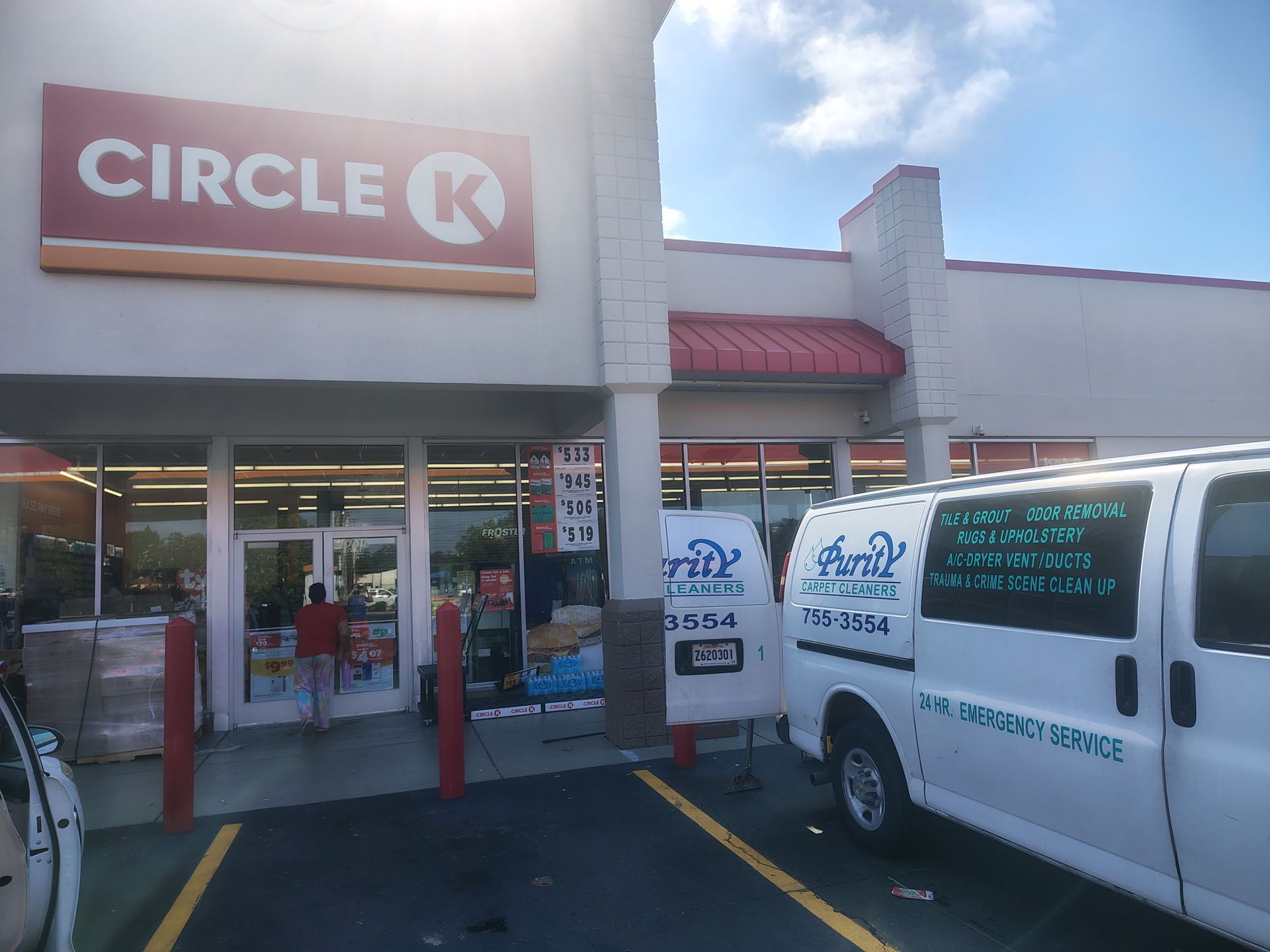 Circle K storefront with parked white service van in front under bright sunlight