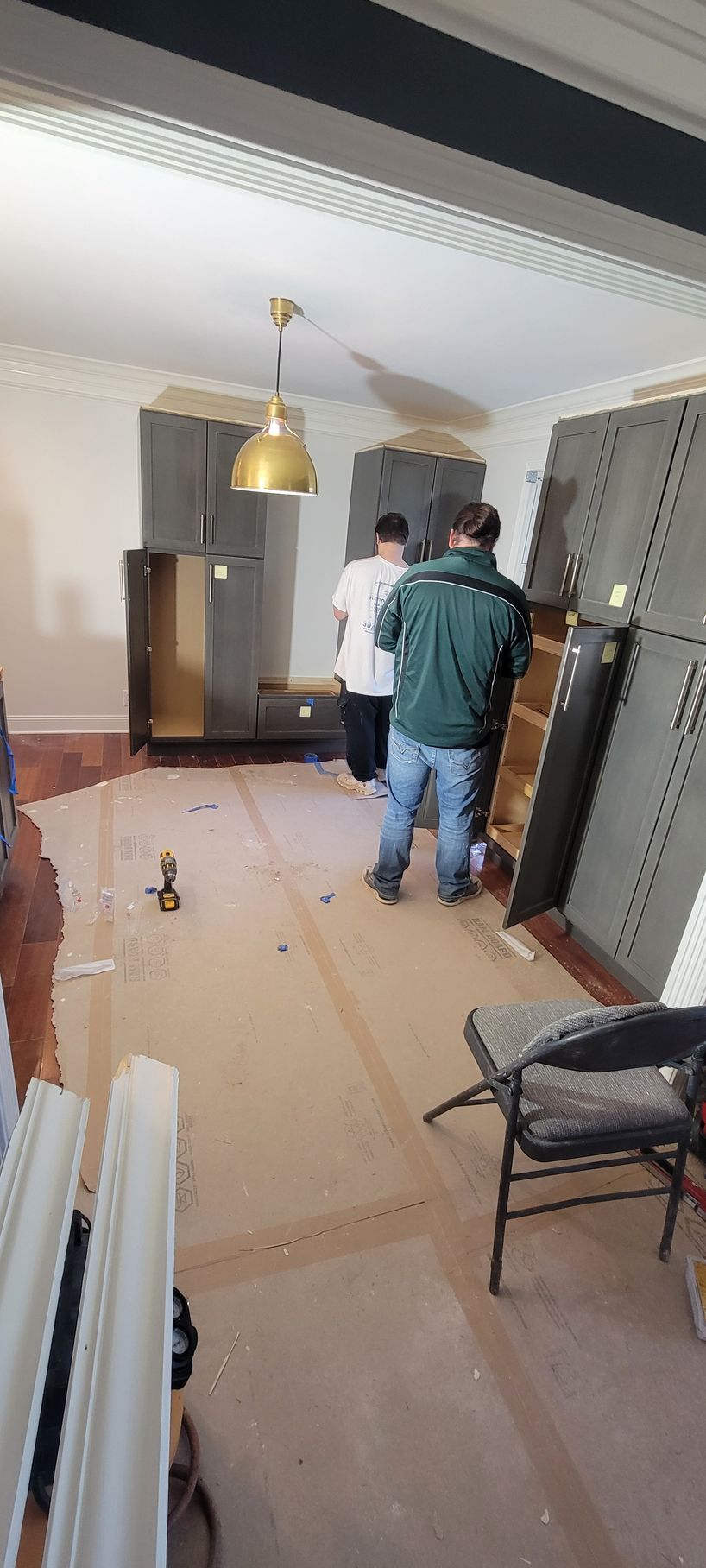 A group of people are standing in a room.