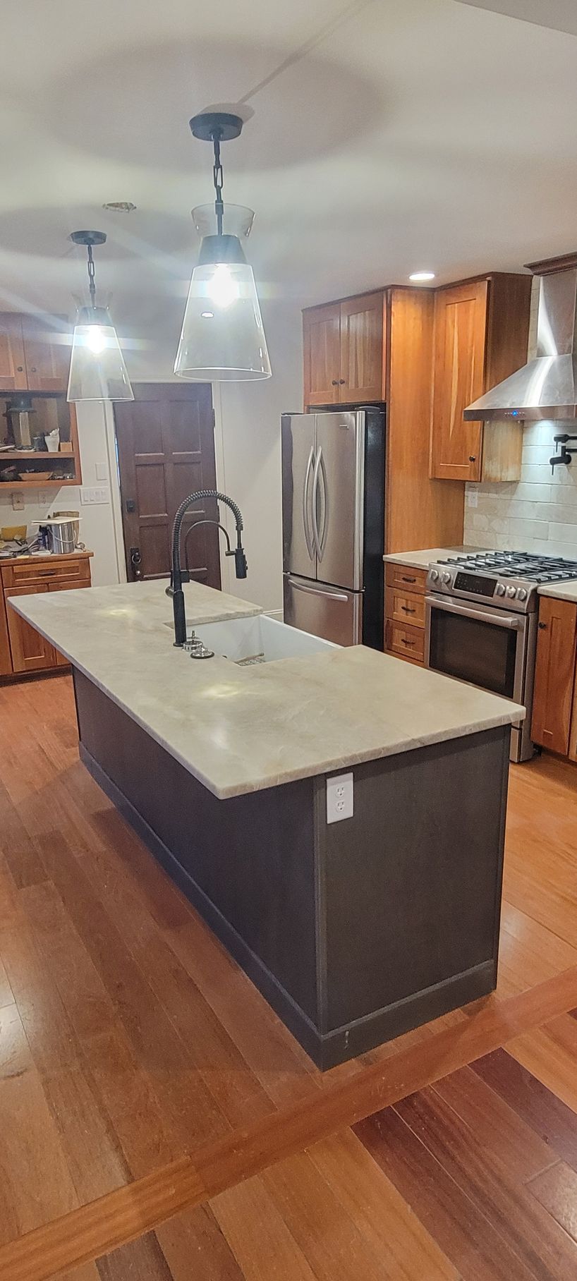 There is a large island in the middle of the kitchen.