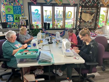 View of a small selection of the interior of Rachel Ann Quilts quilt shop.