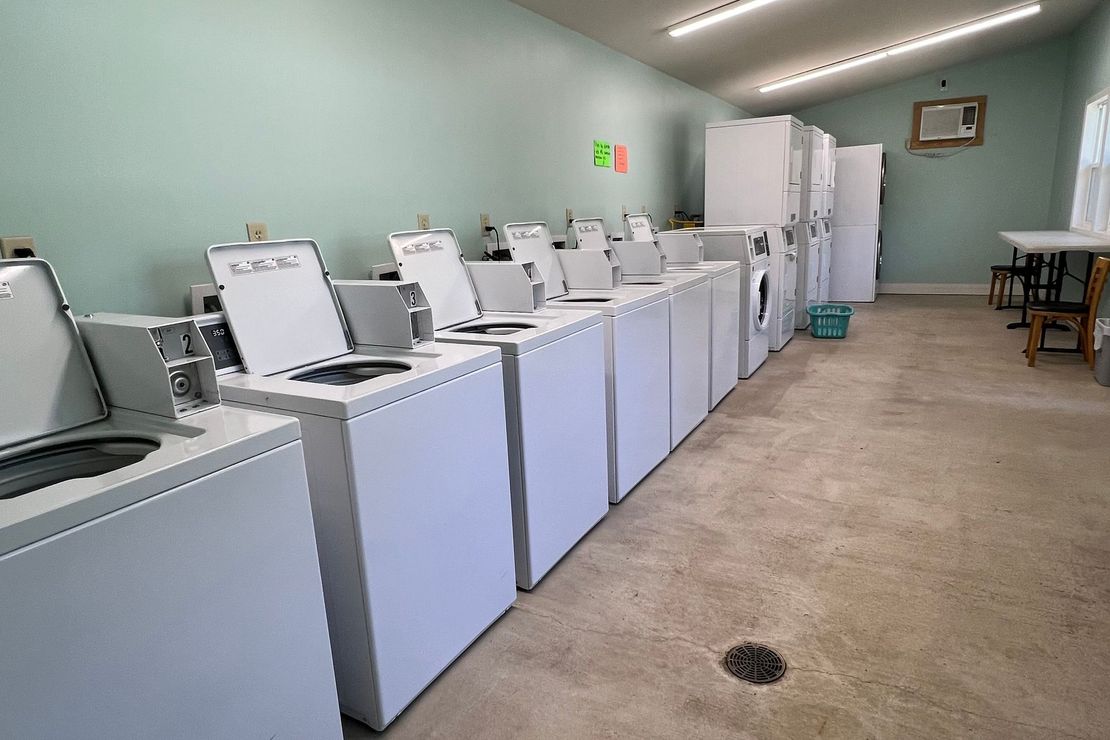 A laundromat with a lot of washers and dryers