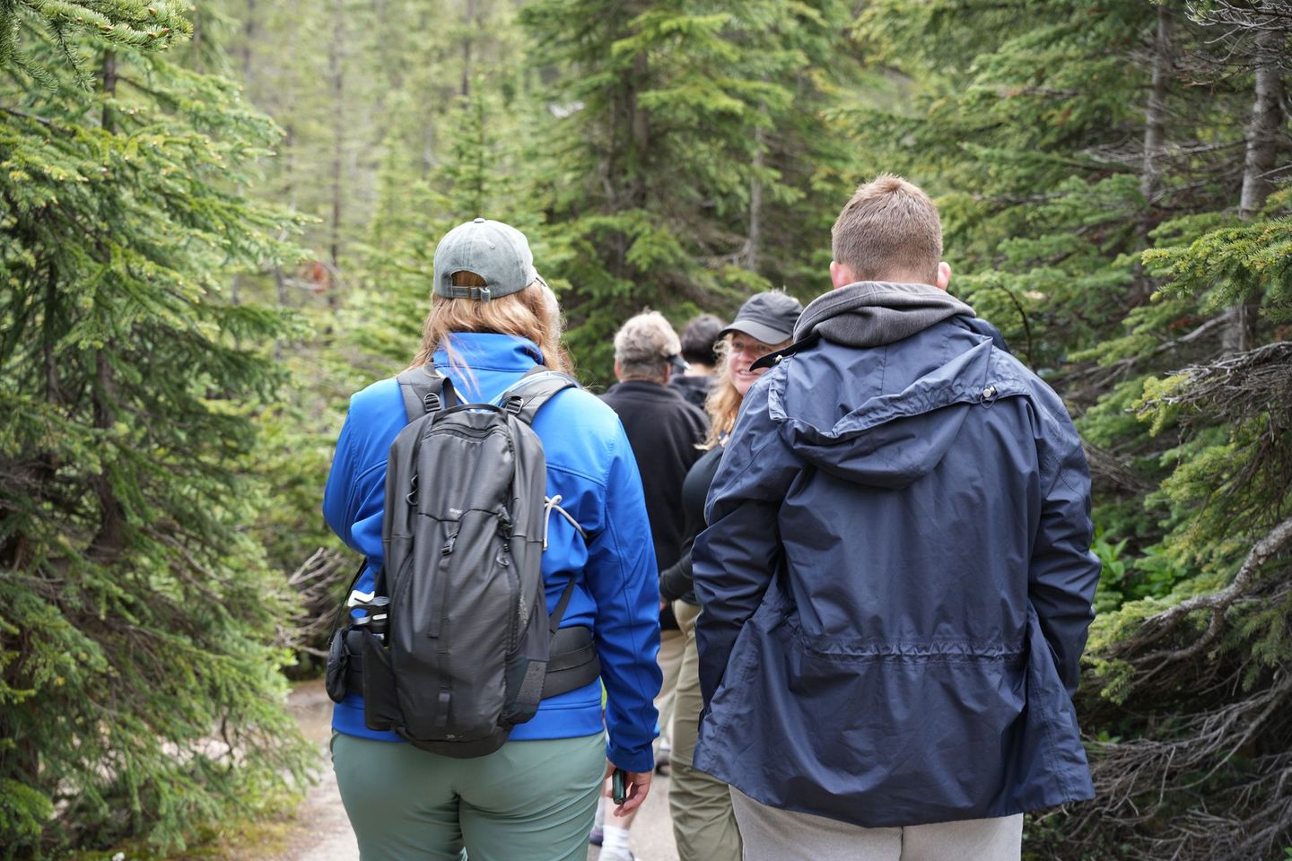 Tour group hiking Takkakaw Falls trail, Banff Bear Travel guided hiking tour Yoho National Park