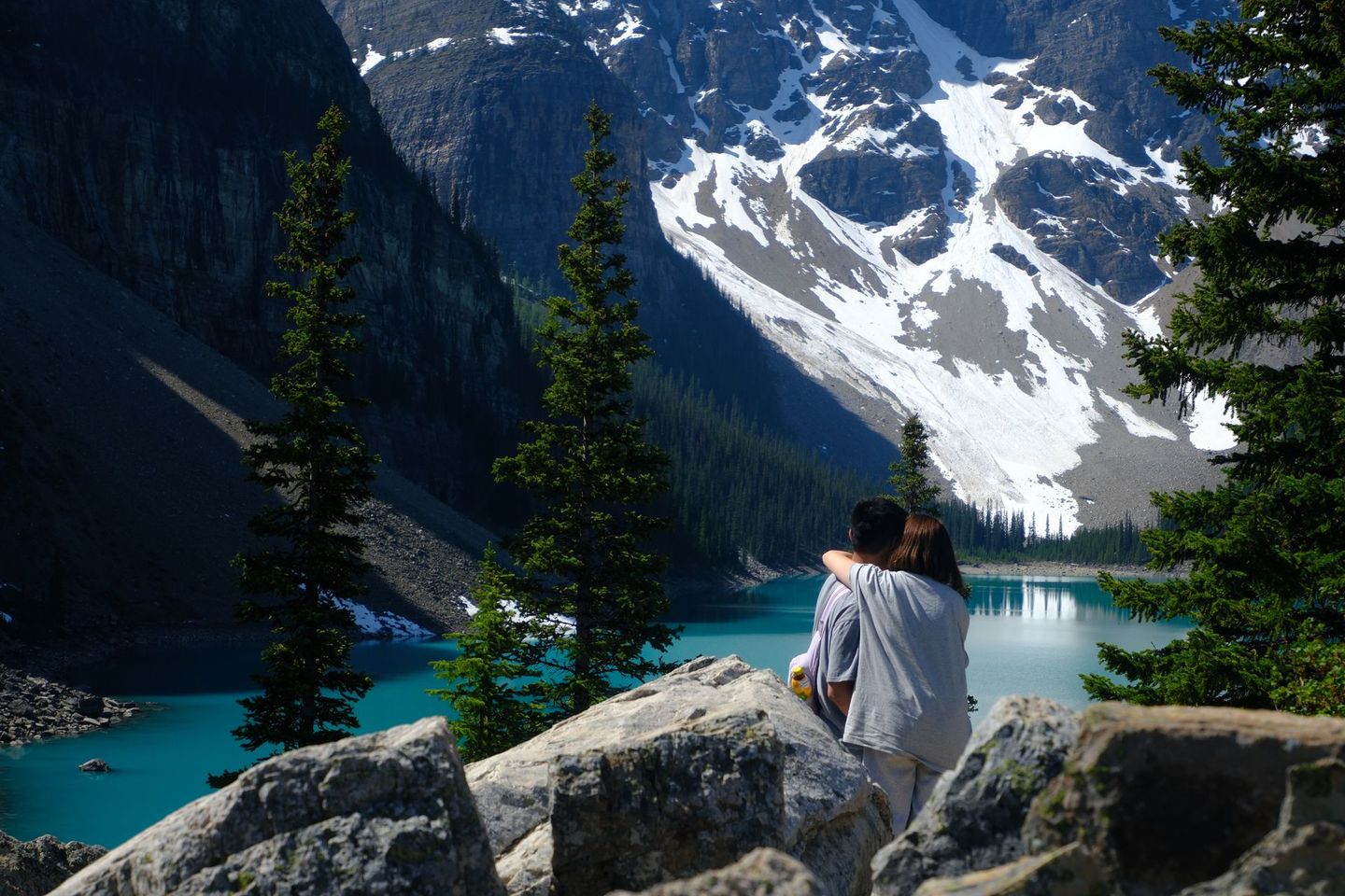 Couple in Moraine Lake, Banff National Park captured by Banff Bear Travel professional photographer guide