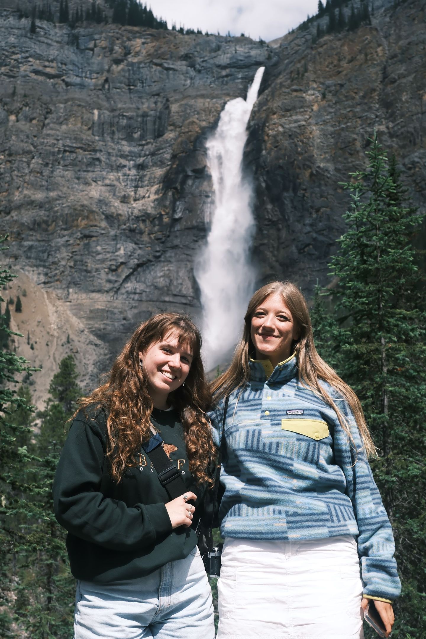 Guests at Takakkaw Falls Yoho National Park one of Canada's tallest waterfalls, Banff Bear Travel day tour