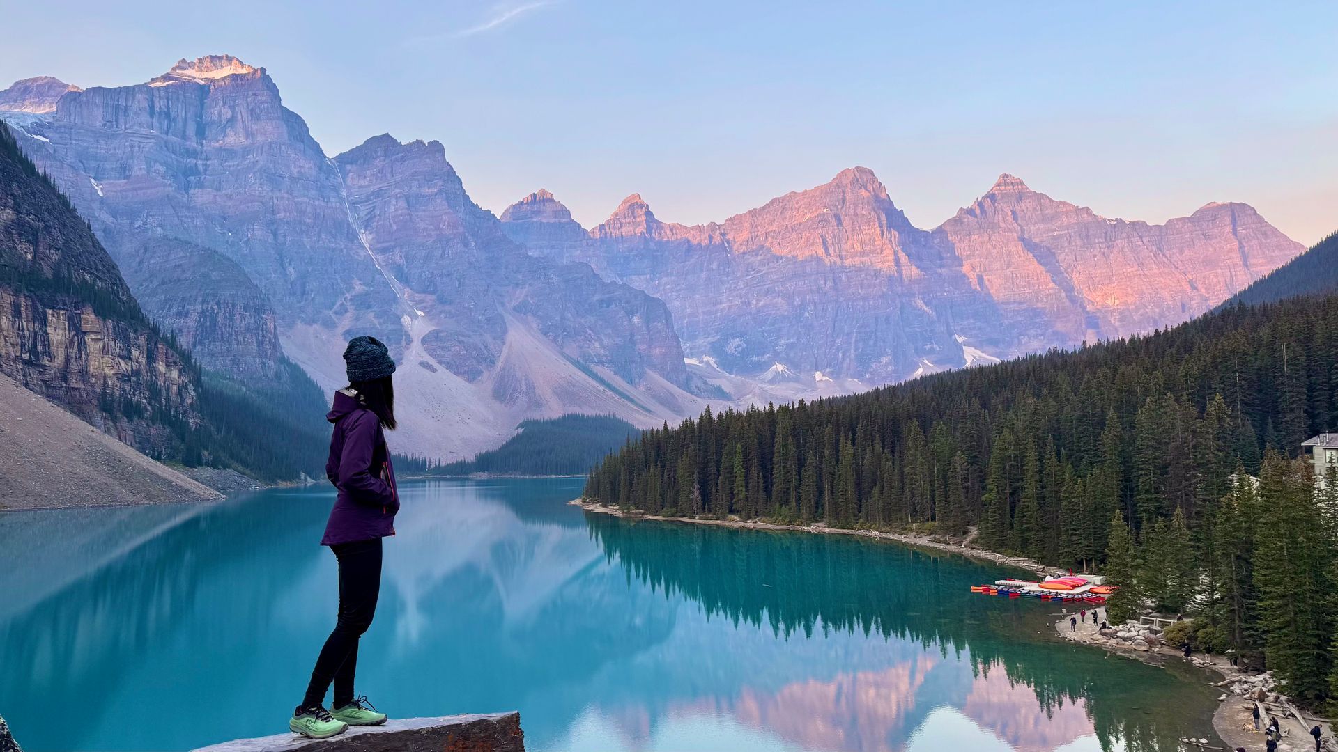 Solo traveler at Moraine Lake turquoise water Banff small group 