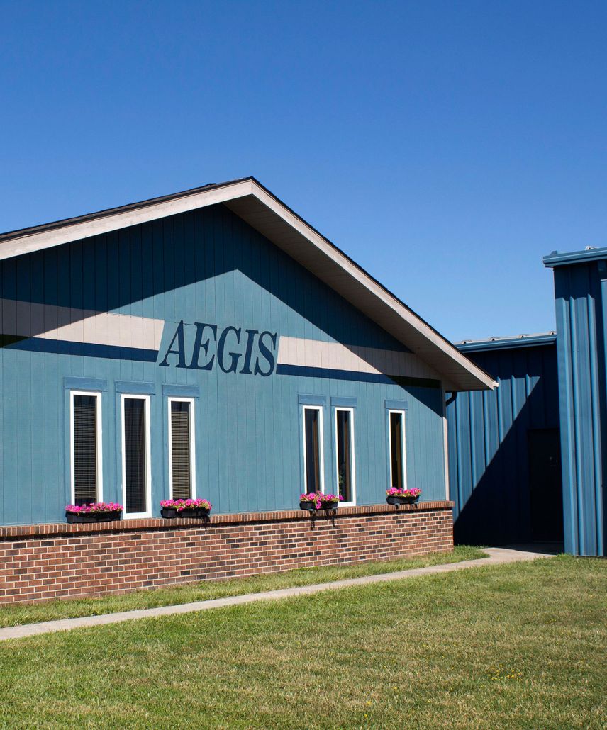 A blue building with the word aegis on it