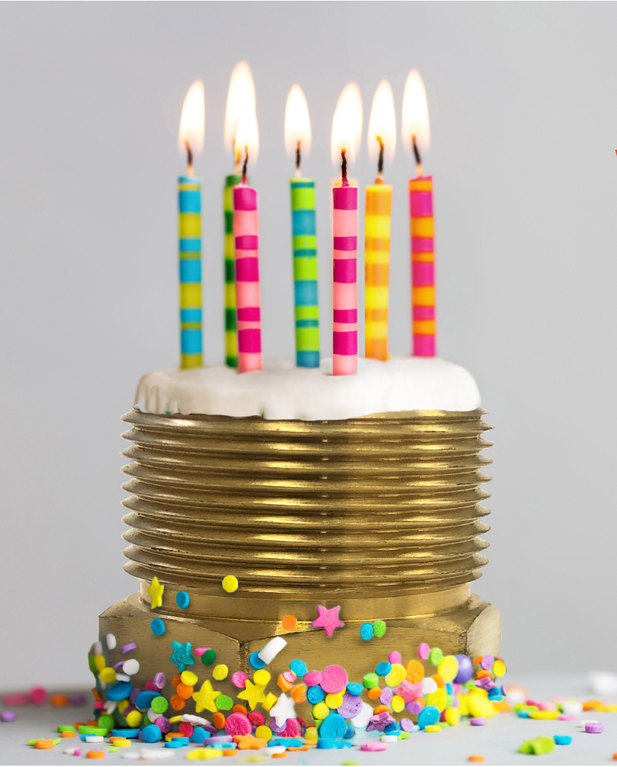 A birthday cake with candles and sprinkles on it