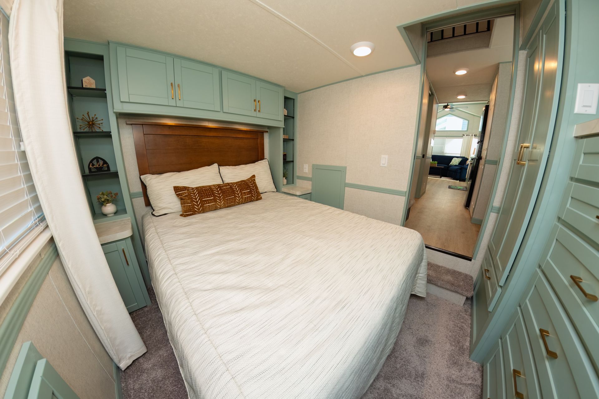 there is a large bed in the middle of the room .