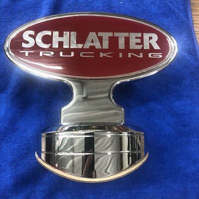 Chrome truck emblem with red oval top: