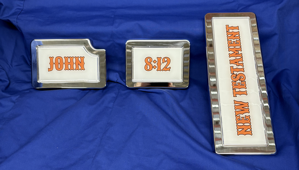 Three framed text tiles on a blue surface: