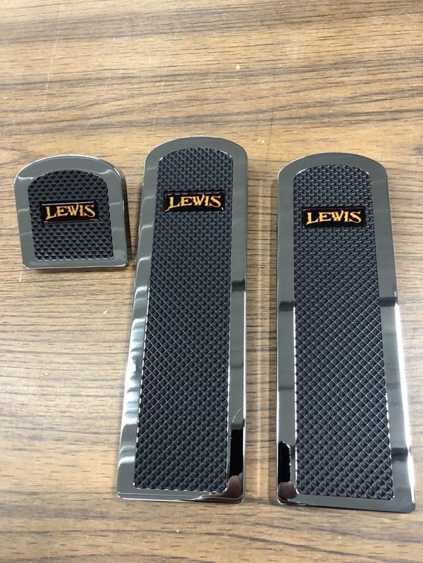 Set of three black and chrome foot pedals with