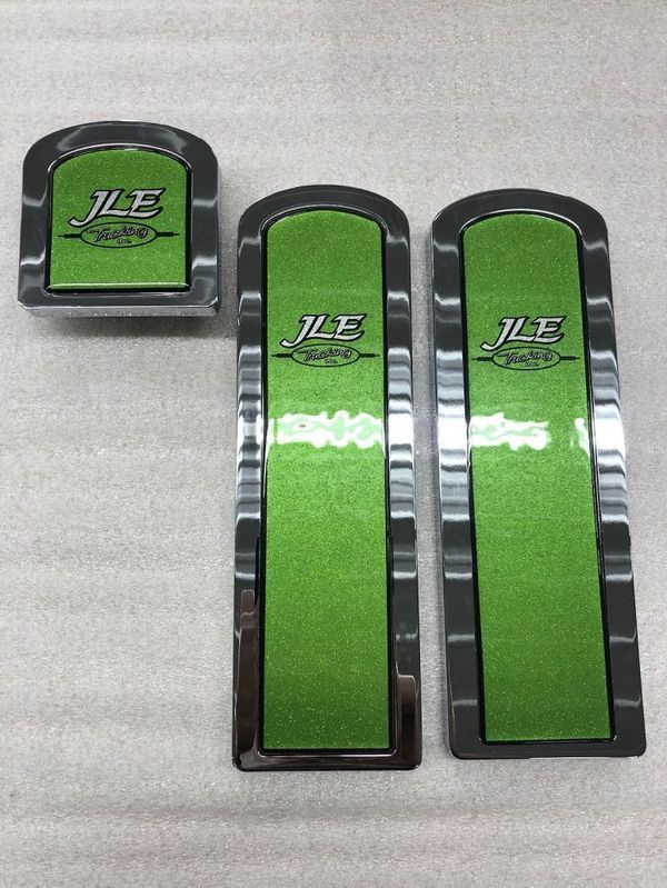 Set of three metallic car parts: small square, two long rectangles. Green center with