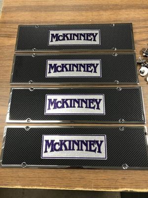 Four license plate frames with