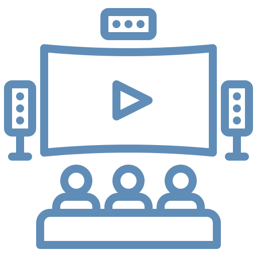 A blue line icon of three people sitting in front of a wide-screen display with speakers on either side.