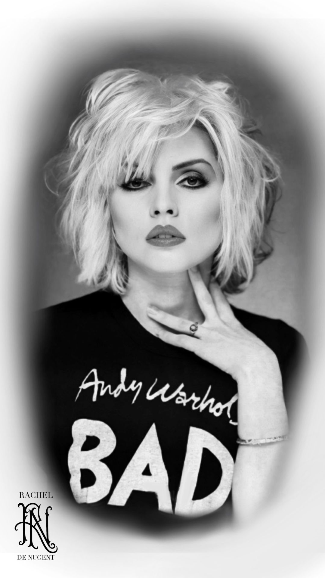 Black-and-white portrait poster of a blonde woman with “Andy Warhol BAD” text