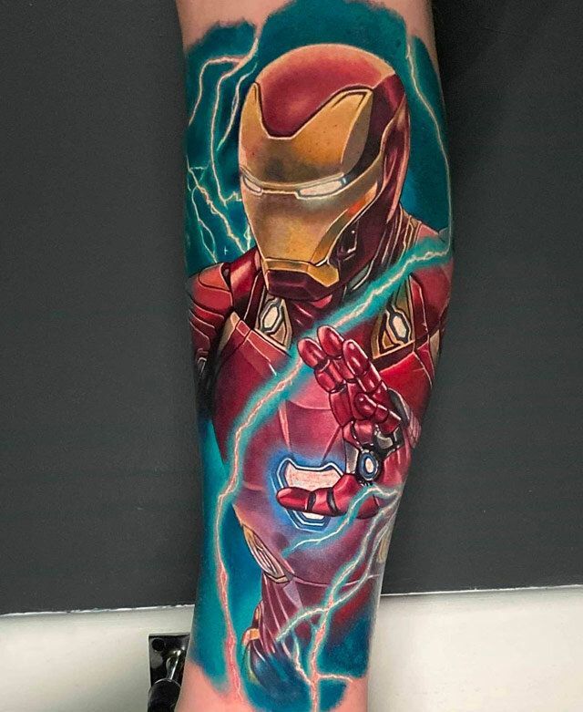 A person has a tattoo of iron man on their leg.