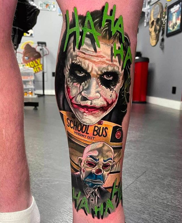 A person has a tattoo of the joker on their leg.