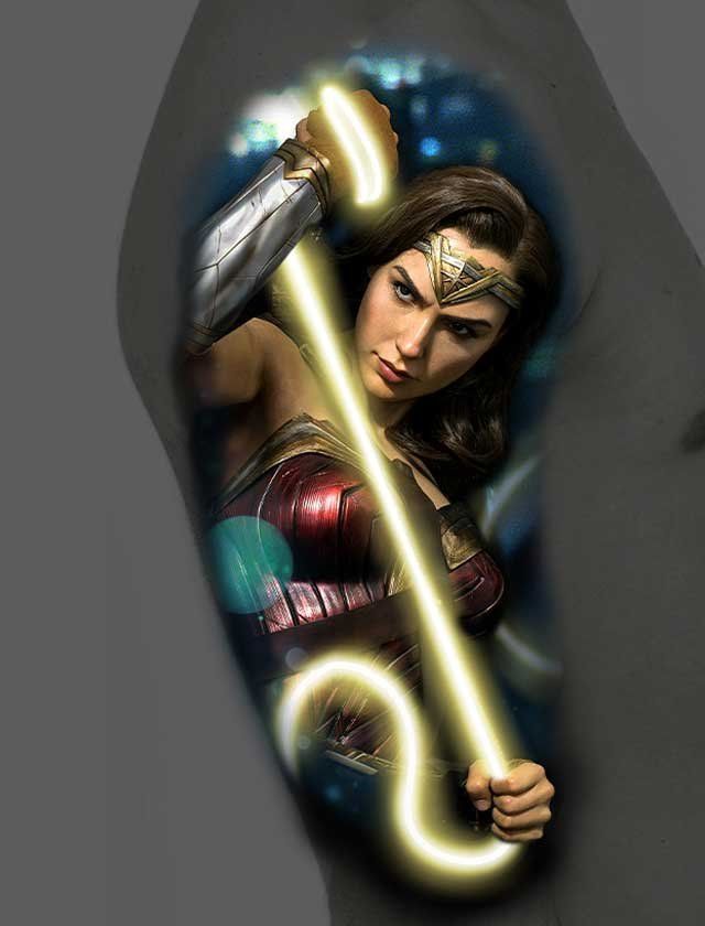 A tattoo of wonder woman holding a lightning bolt.
