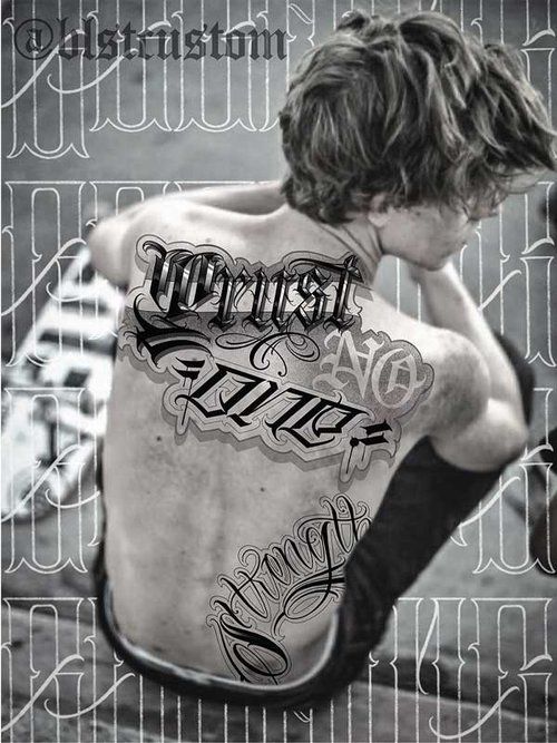 A man has a tattoo on his back that says worst and no rules
