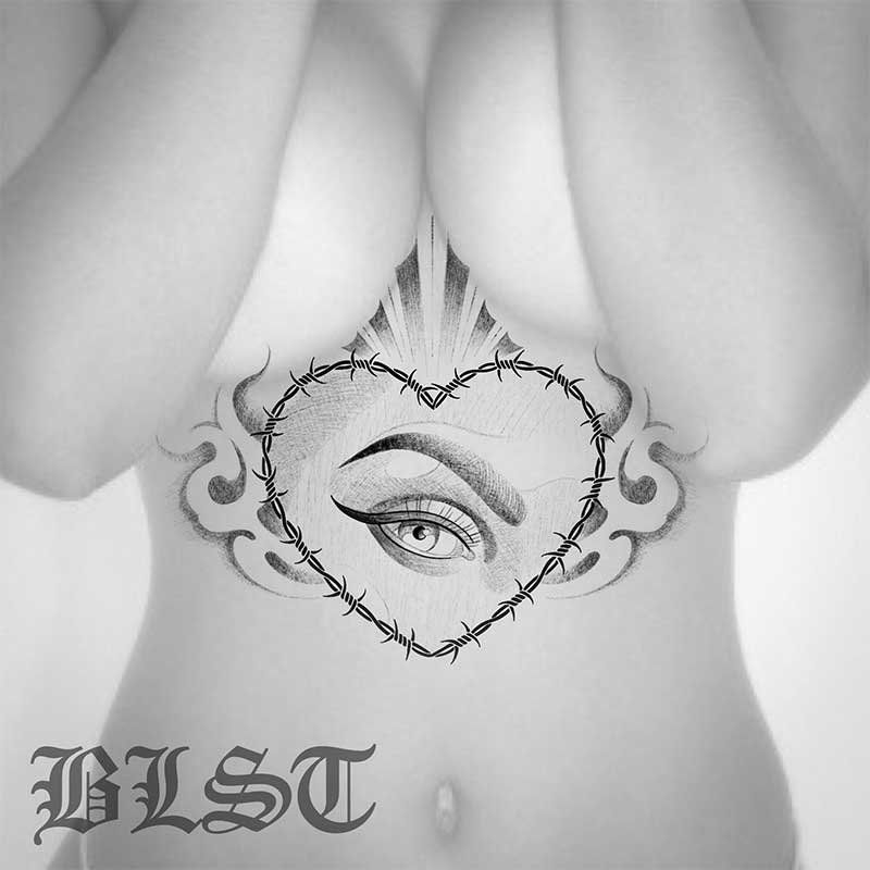 A woman has a tattoo of an eye in a heart with barbed wire around it