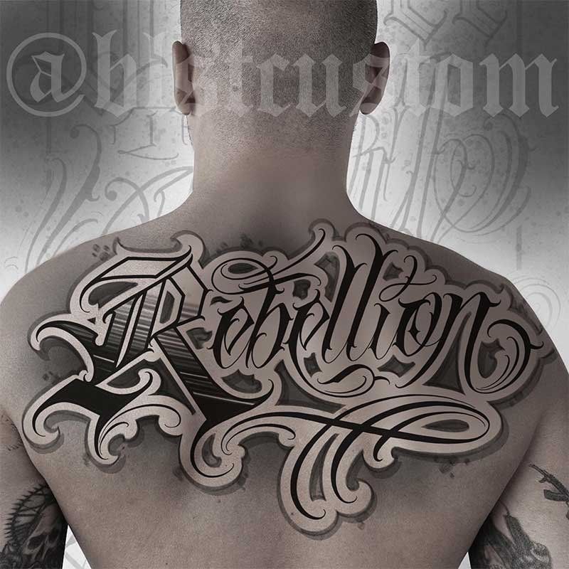 A man has a tattoo on his back that says rebellion