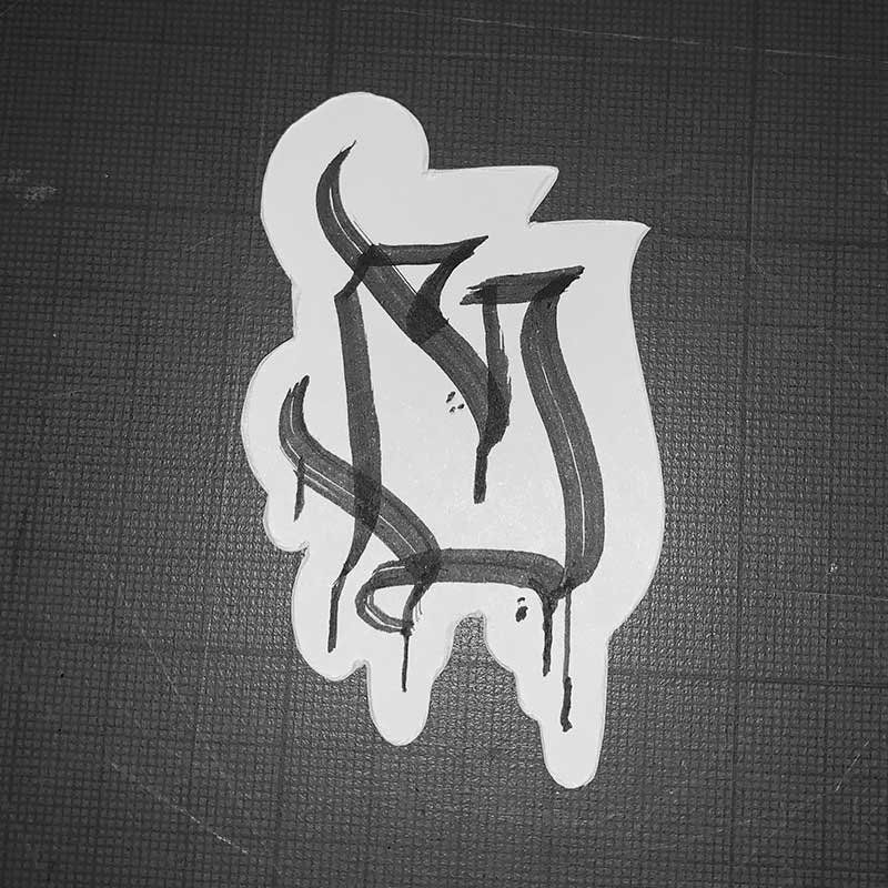A black and white drawing of a letter s on a piece of paper