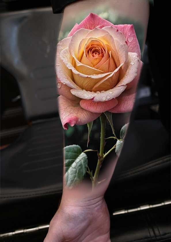 A person has a tattoo of a rose on their arm