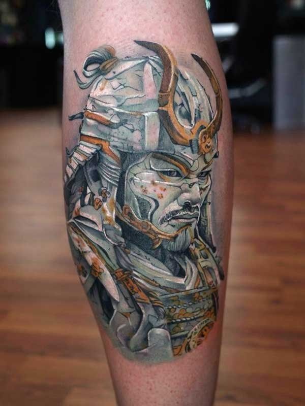 A person has a tattoo of a samurai on their leg.
