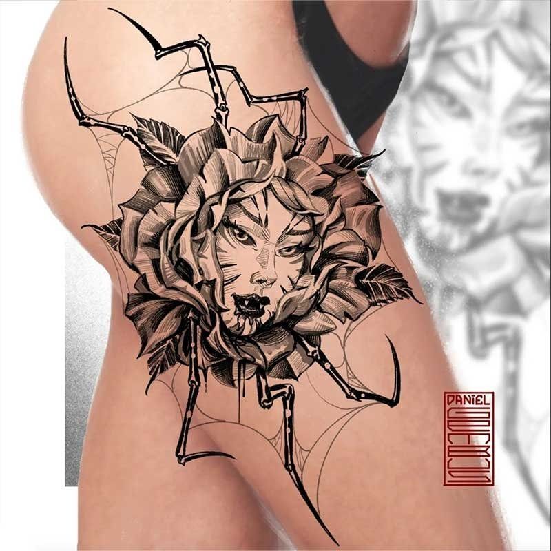A woman has a tattoo of a spider with a face on it