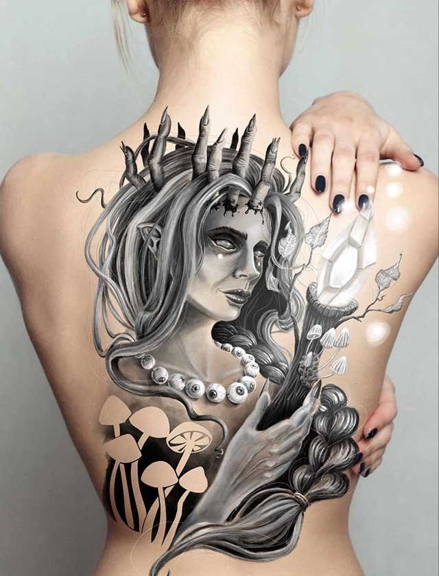 A woman has a tattoo on her back of a woman with horns and mushrooms.
