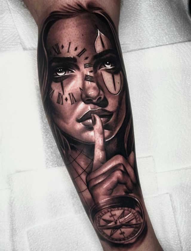 A black and white tattoo of a woman holding her finger to her mouth.