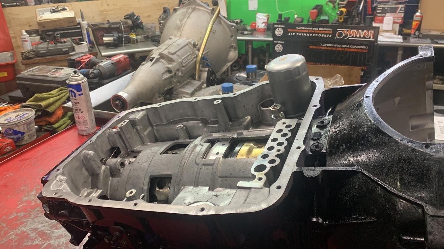 A car engine is being worked on in a garage