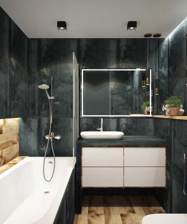 Cast iron bath-shower in a small bathroom, with a corner sink.