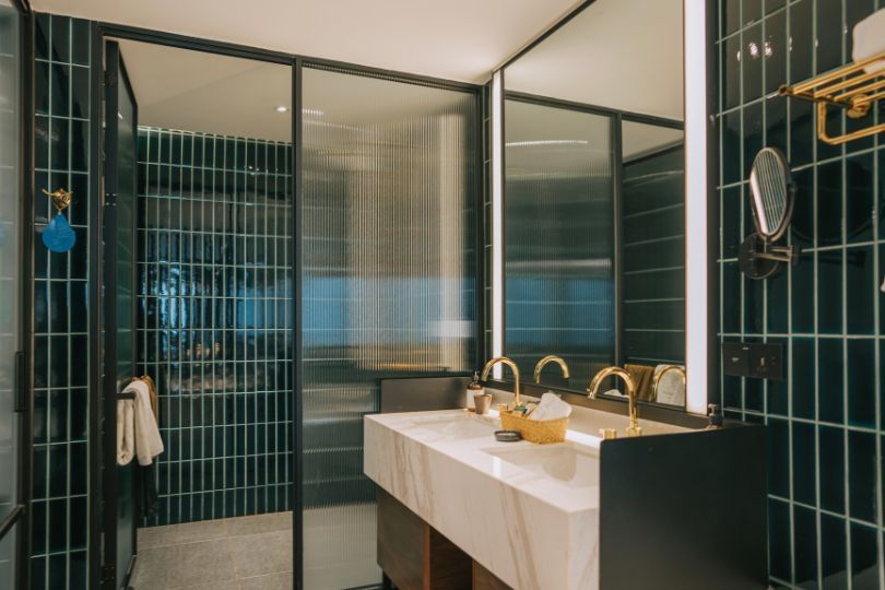 Double basins to share in a blue bathroom.