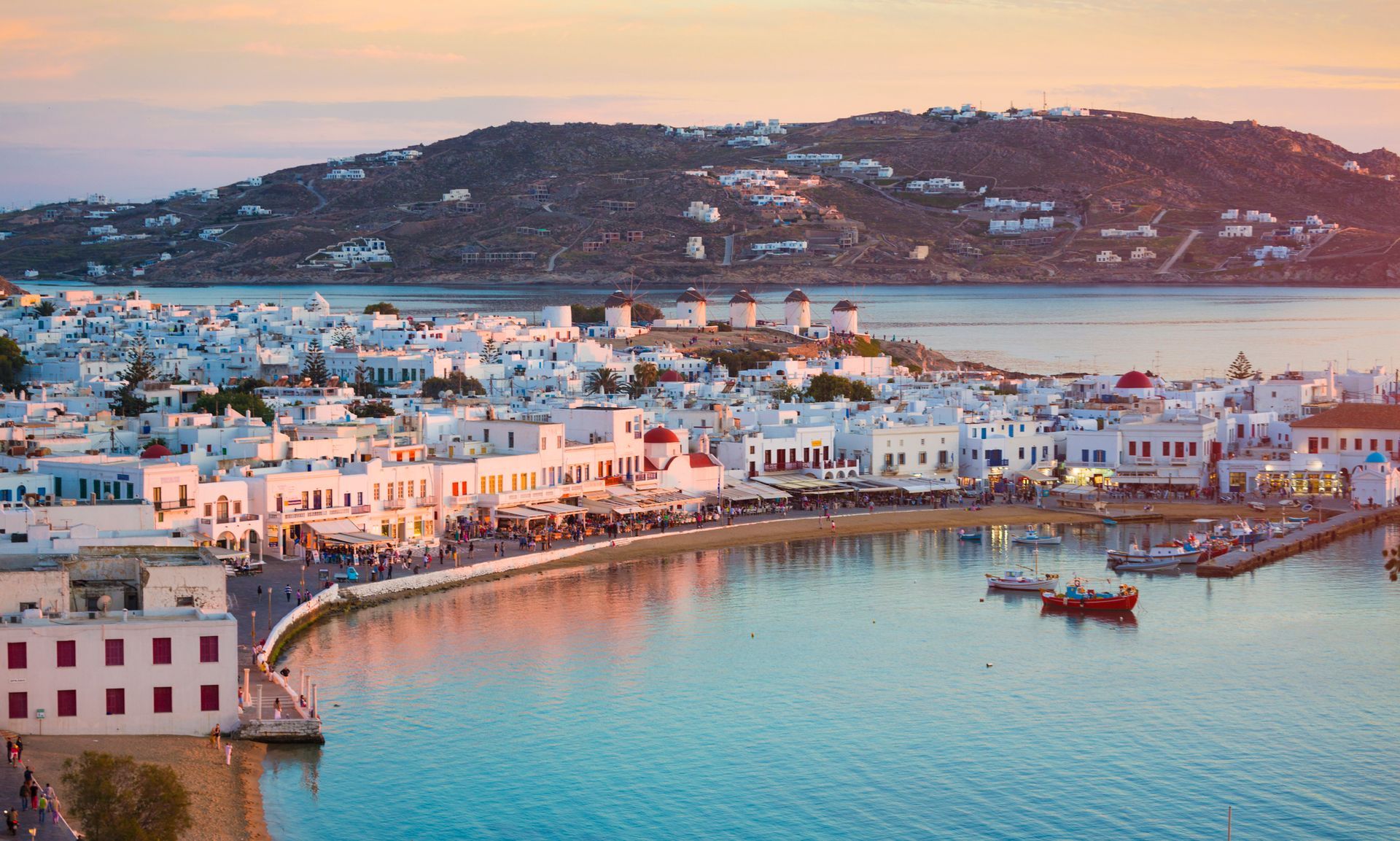 Mykonos  An aerial view of a small town next to a body of water.