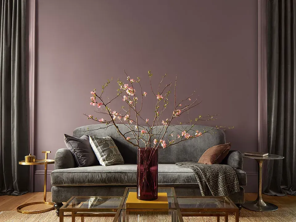 There is a vase of flowers on the table in the living room.