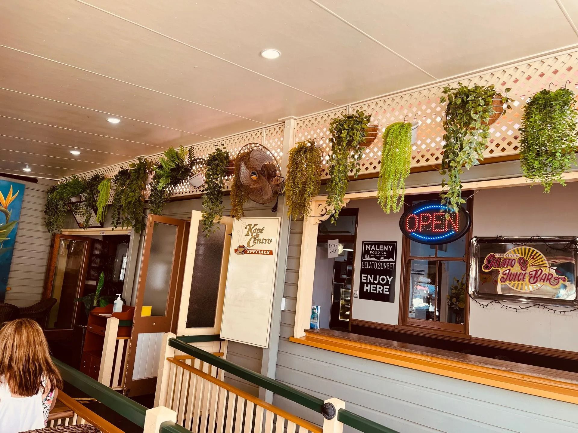 Cafe Exterior with Hanging Plants — Kape Centro In Childers, QLD