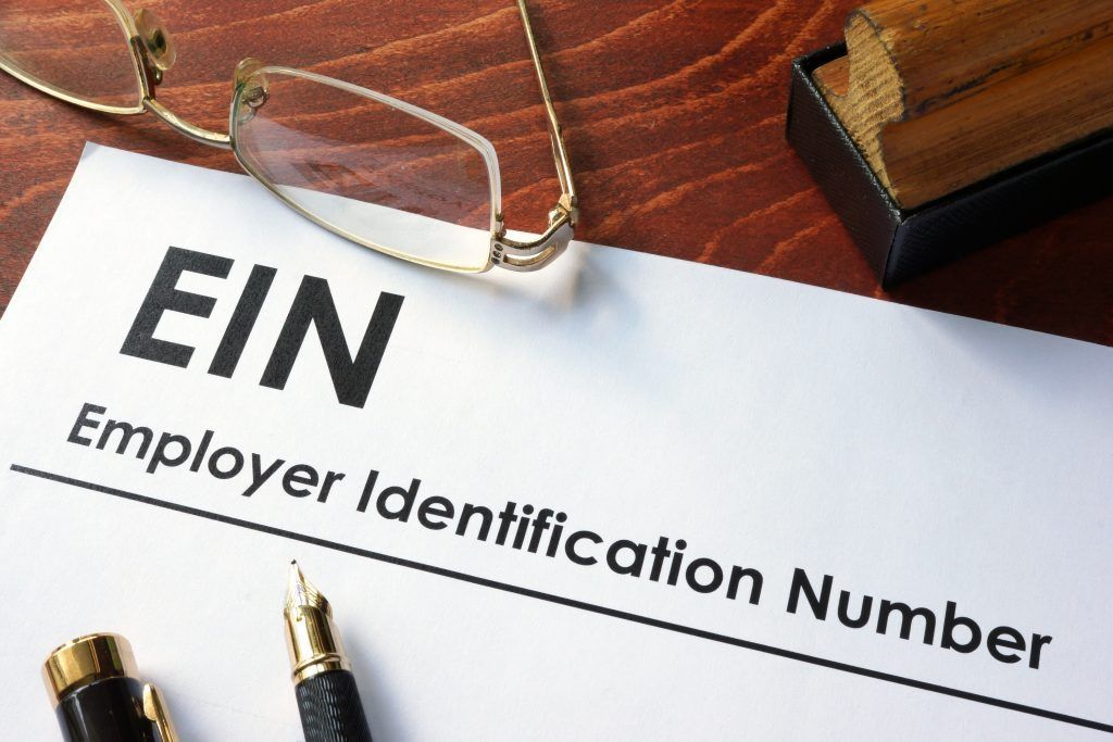 An EIN (Employer Identification Number) document on a wooden desk 