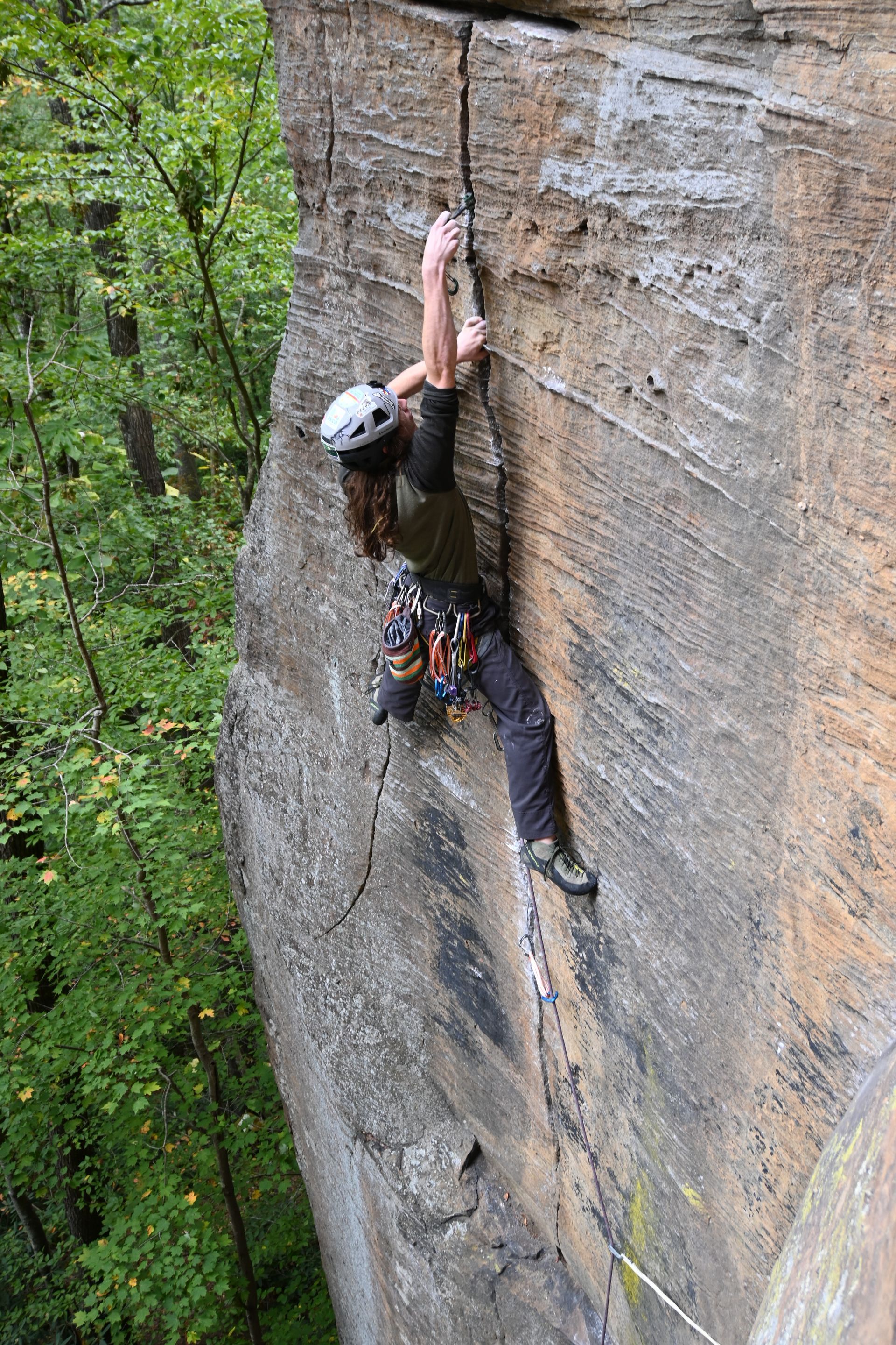 Climber navigates the beautiful, fragile sandstone of the red river gorge