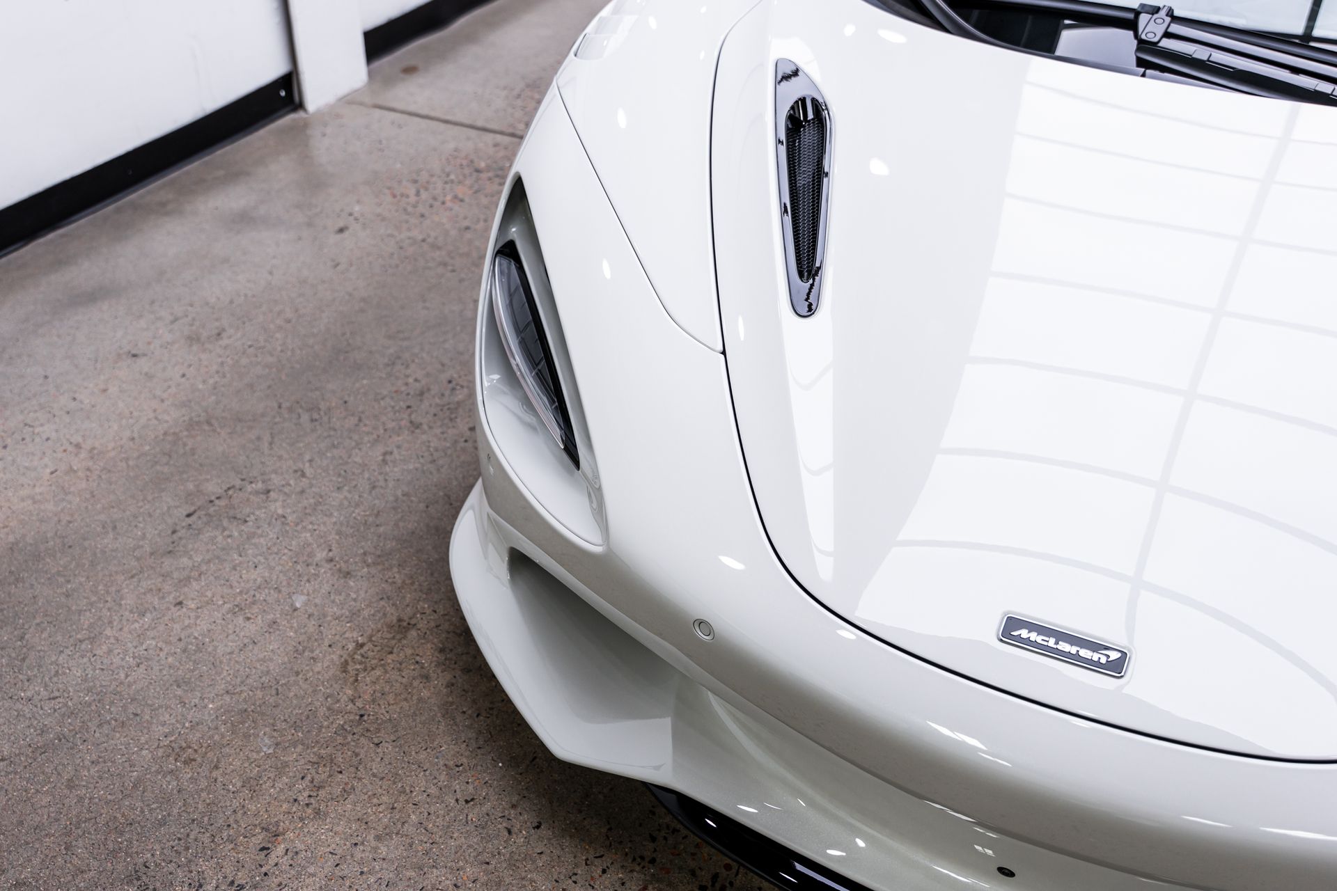 White sports car front end.