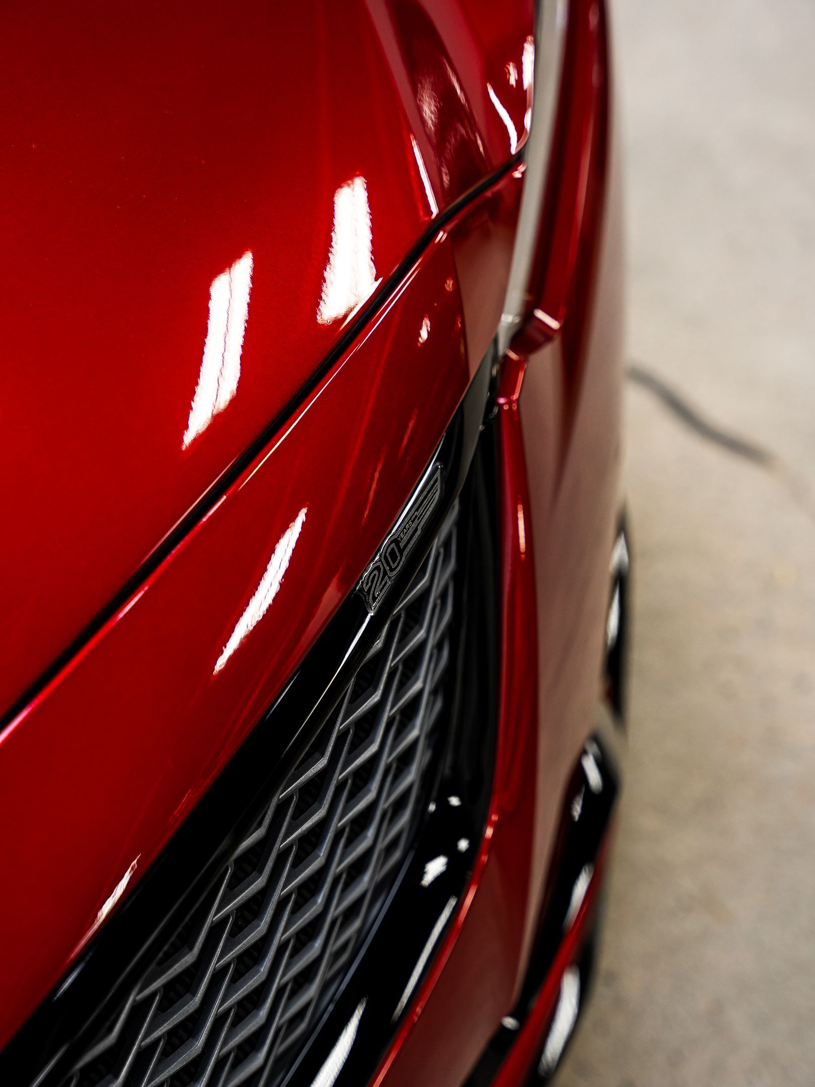 A close up of the front of a red car