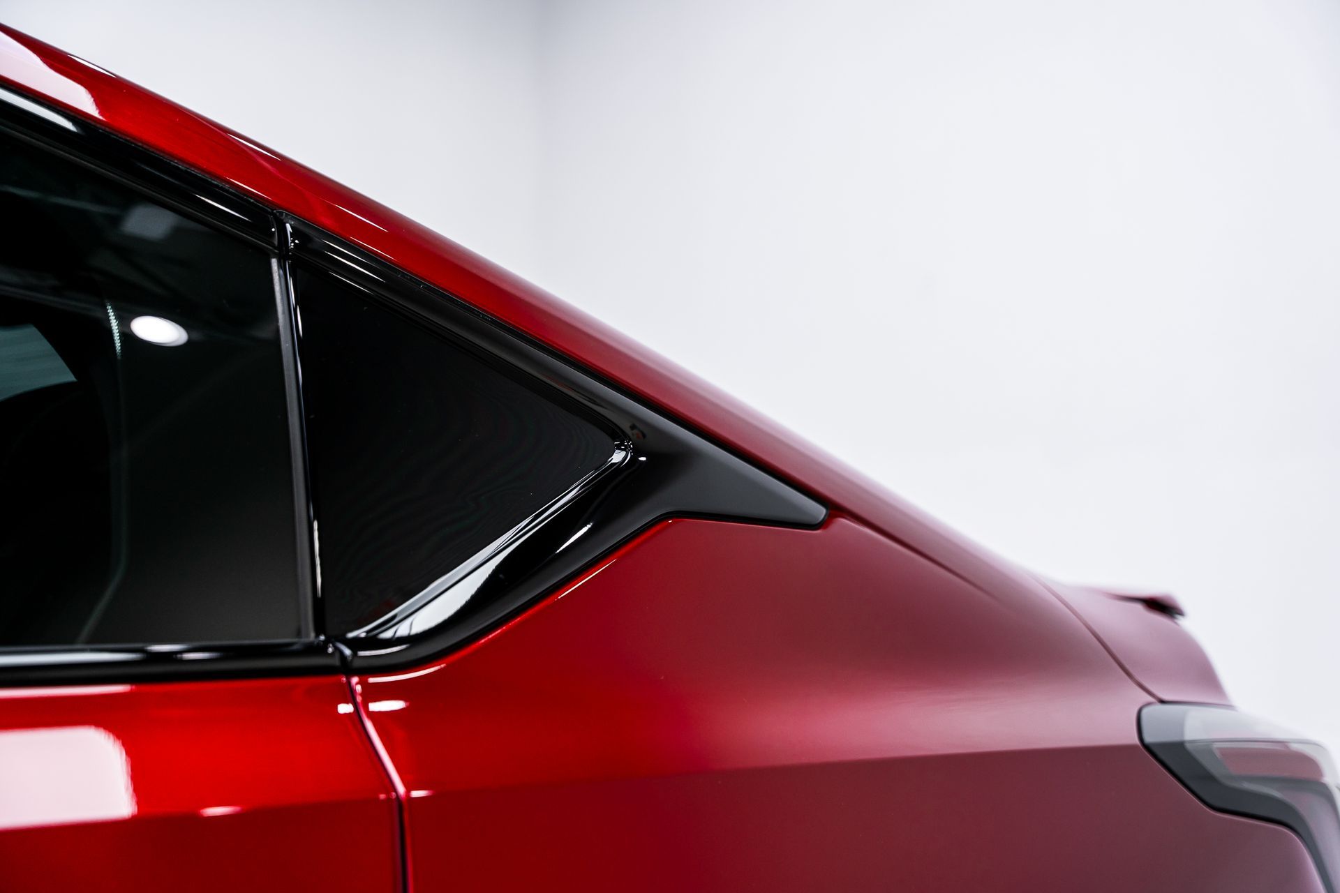A close up of the side of a red car