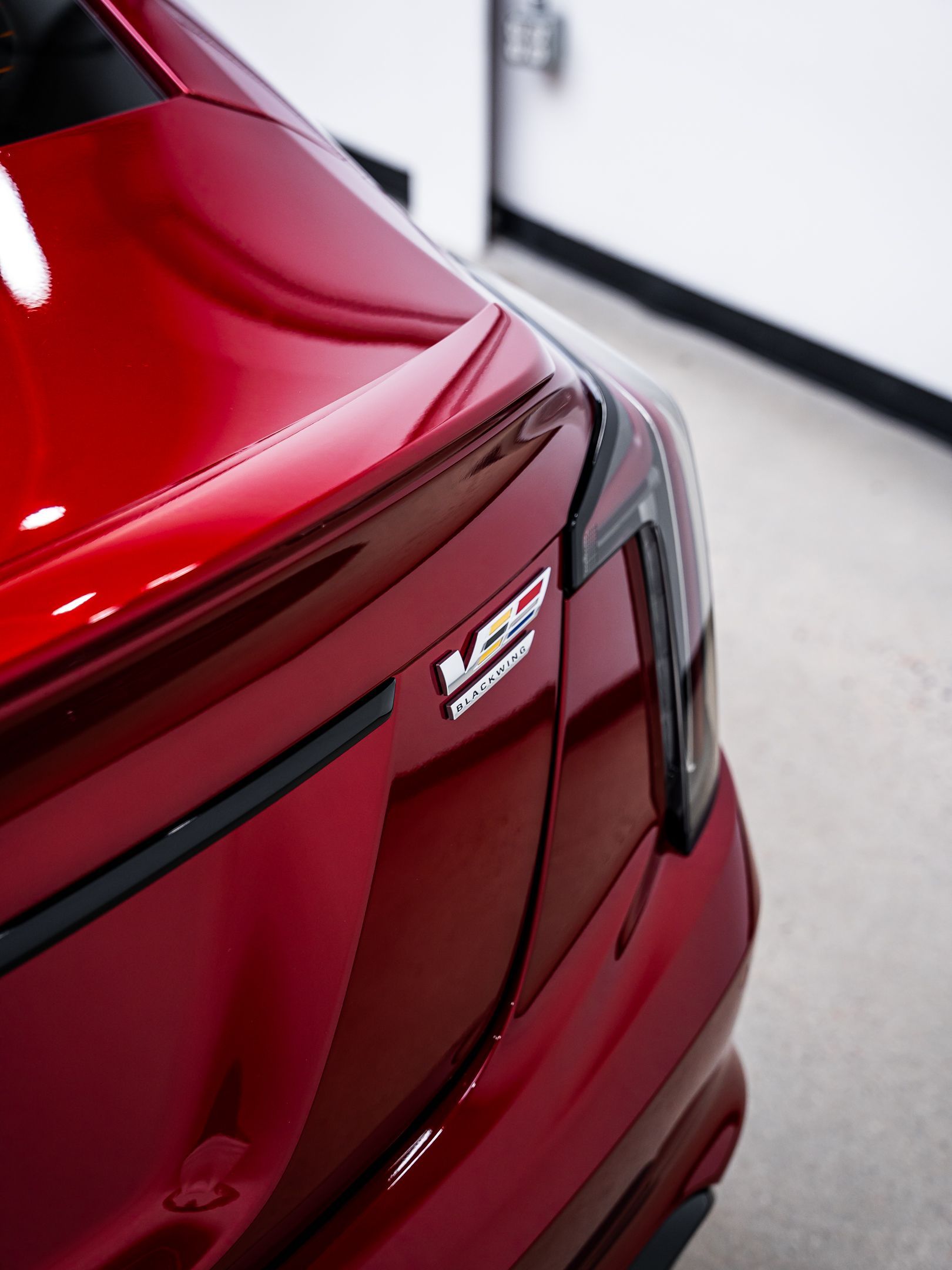 A close up of a red car with the letters ncr on the back