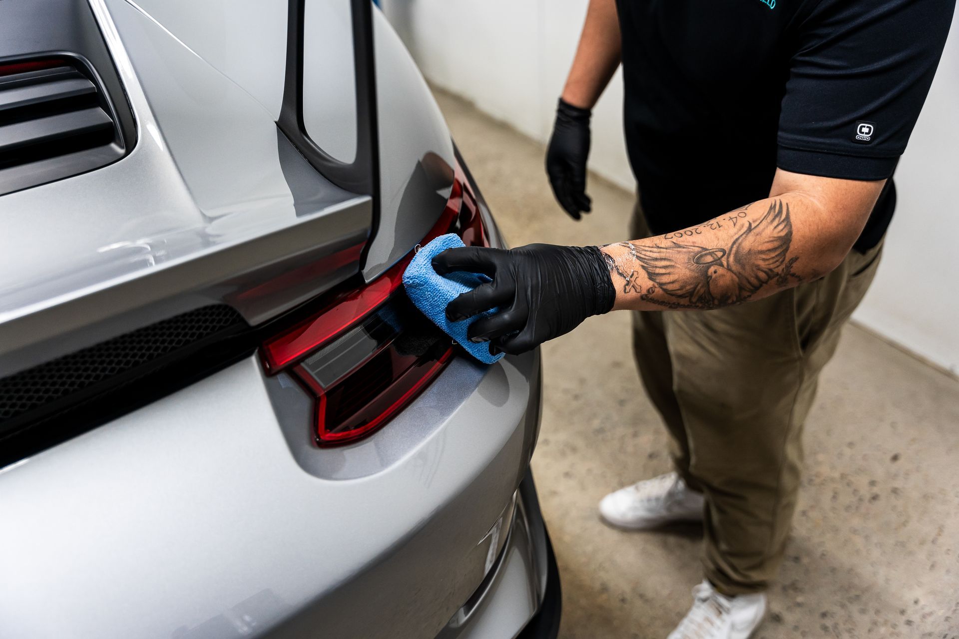 Installing coating on tail light.
