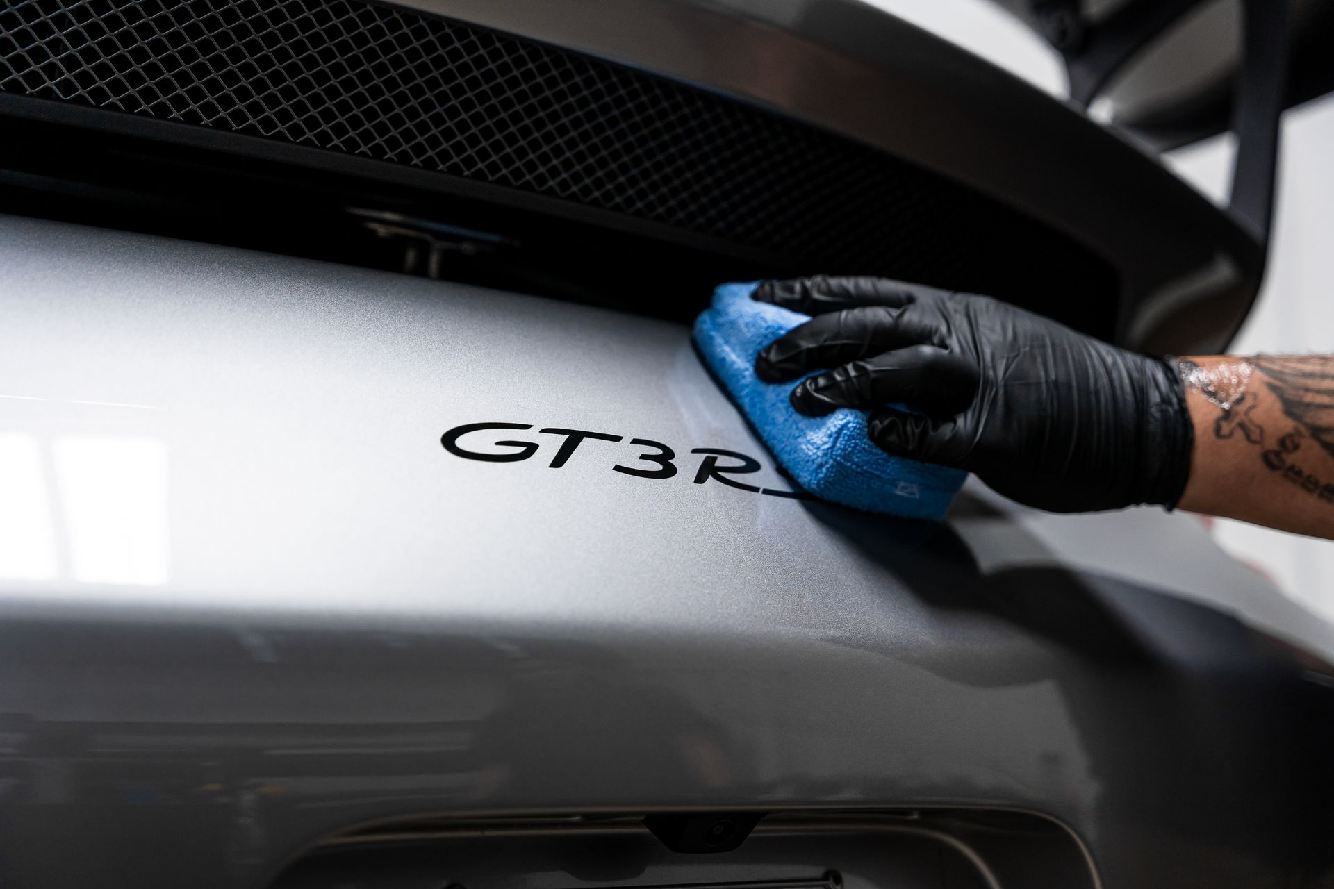 Applying ceramic coating over badging.