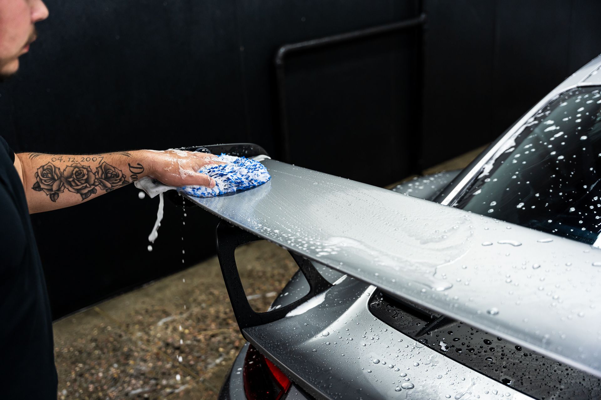 Using a wash mitt to clean paint