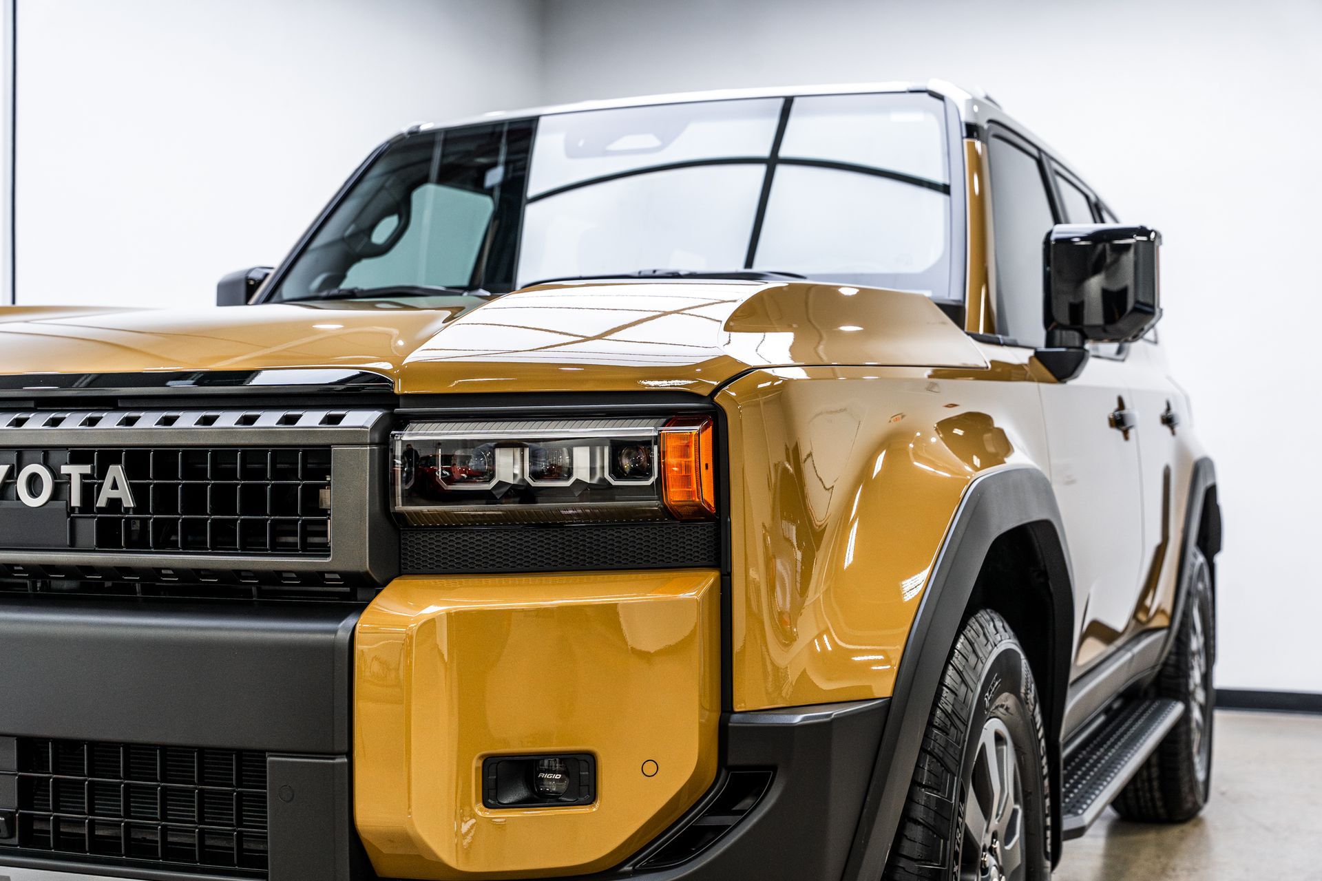 Gold Toyota SUV with black accents.