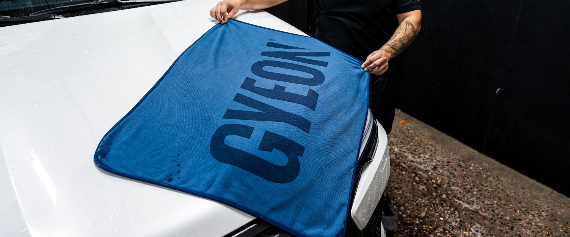 Person holding a blue towel with 