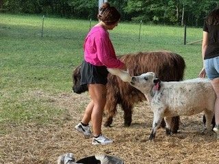 Carmen helping with bottle time for Willow. Highlands in Anderson, SC.