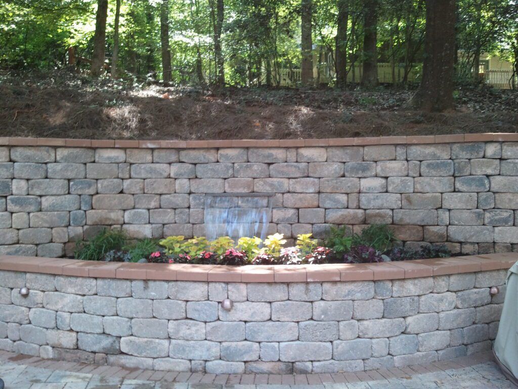 A brick wall with a waterfall in the middle of it